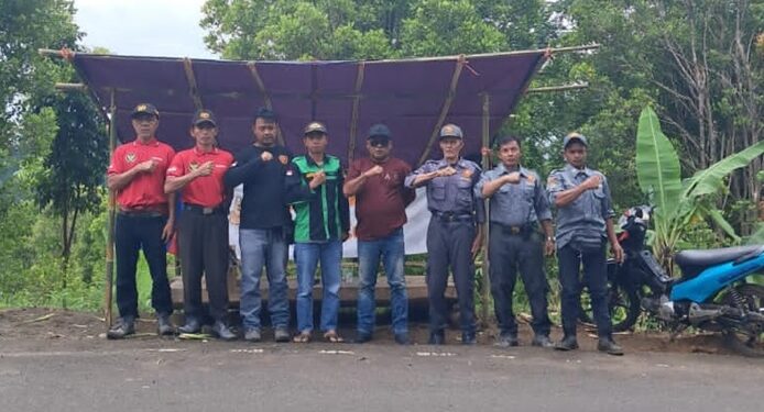 Kades Caringin Berikan Rasa Aman dan Nyaman Pada Pengguna Jalan Saat Liburan Menjelang Natal dan Tahun Baru (NATARU)